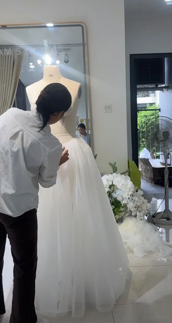 A made-to-measure wedding dress cut to the proportions of a petite bride